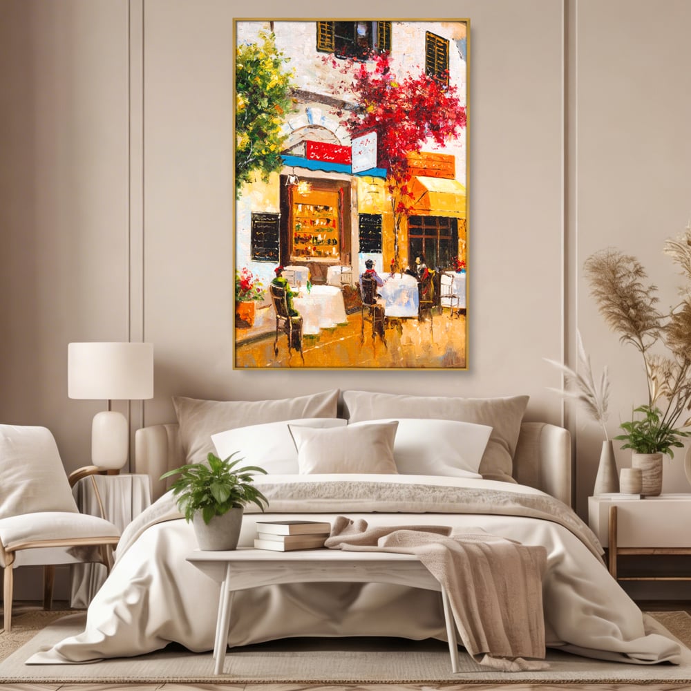 Tablou canvas cu pictura stradala cu terasa, in rama de aluminiu auriu, pe perete intr-un dormitor