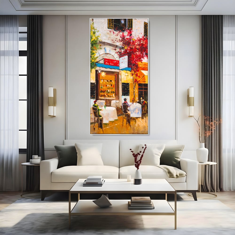 Tablou canvas cu pictura stradala cu terasa, in rama de aluminiu argintiu, pe perete intr-un living