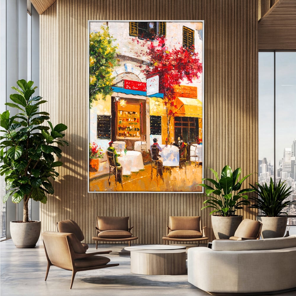 Tablou canvas cu pictura stradala cu terasa, in rama de aluminiu argintiu, pe perete intr-un birou