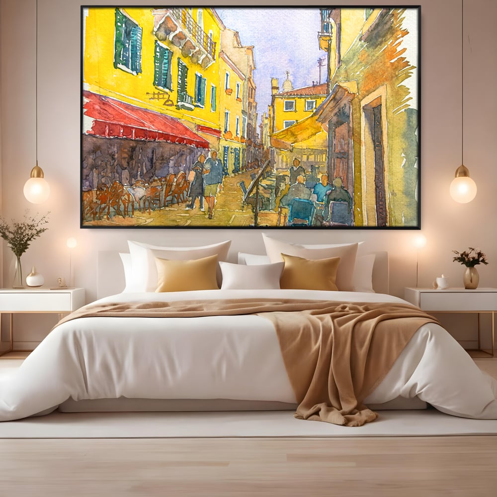 Tablou canvas cu pictura acuarela strada cu terase, in rama de aluminiu negru, pe perete intr-un dormitor