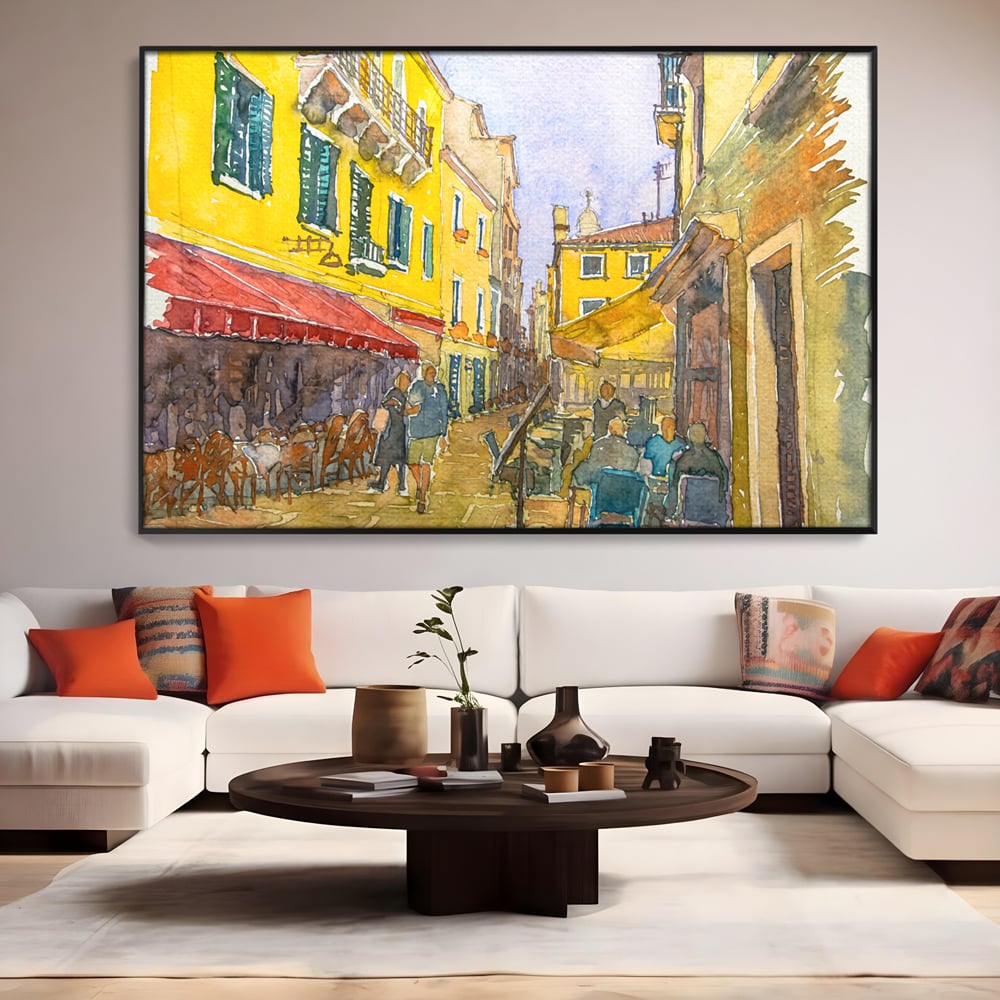 Tablou canvas cu pictura acuarela strada cu terase, in rama de aluminiu negru, pe perete intr-un living