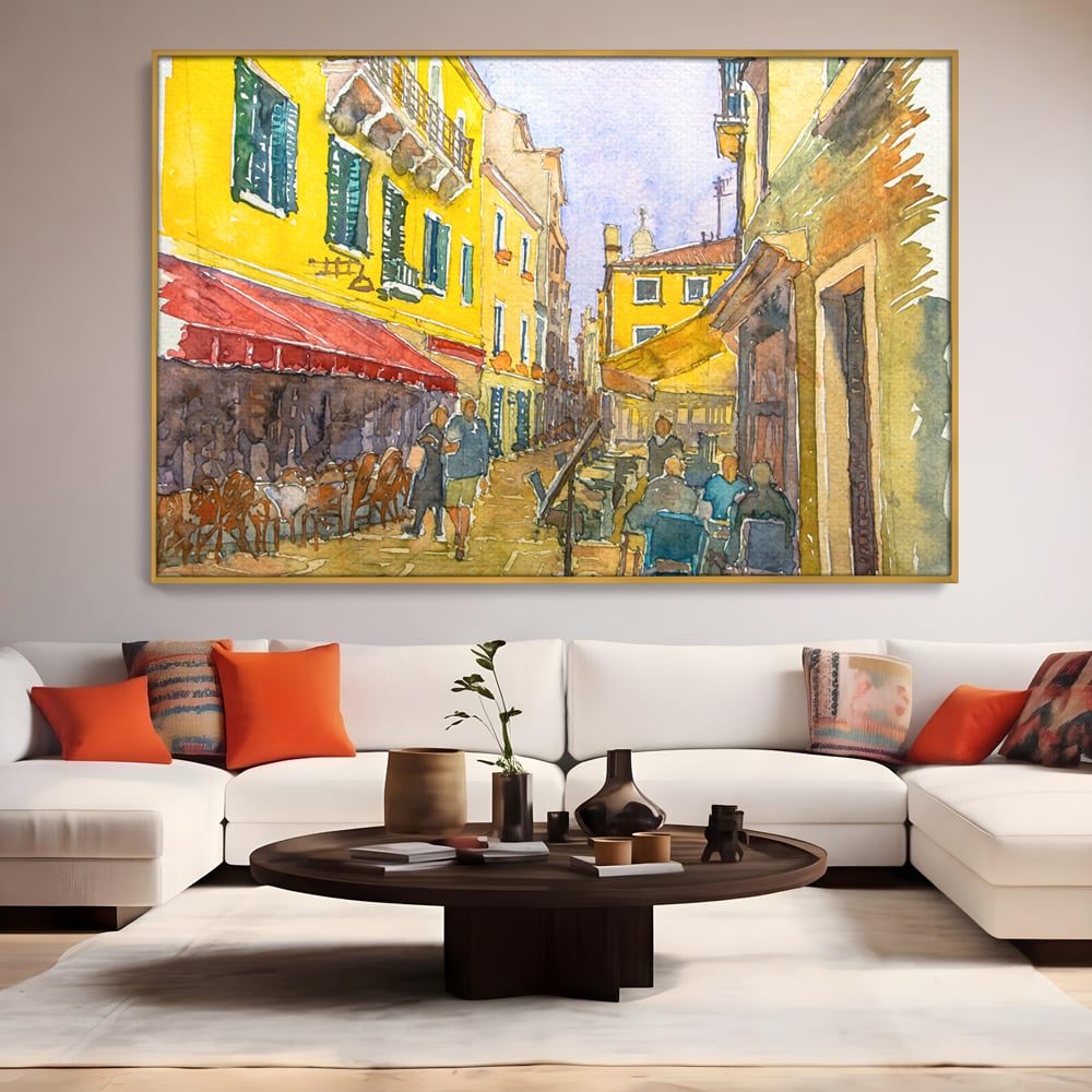 Tablou canvas cu pictura acuarela strada cu terase, in rama de aluminiu auriu, pe perete intr-un living