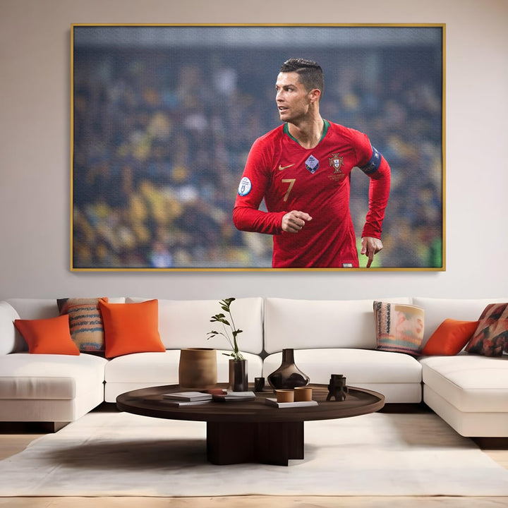 Tablou canvas cu tablou canvas cu cristiano ronaldo, in rama de aluminiu auriu, pe perete intr-un living