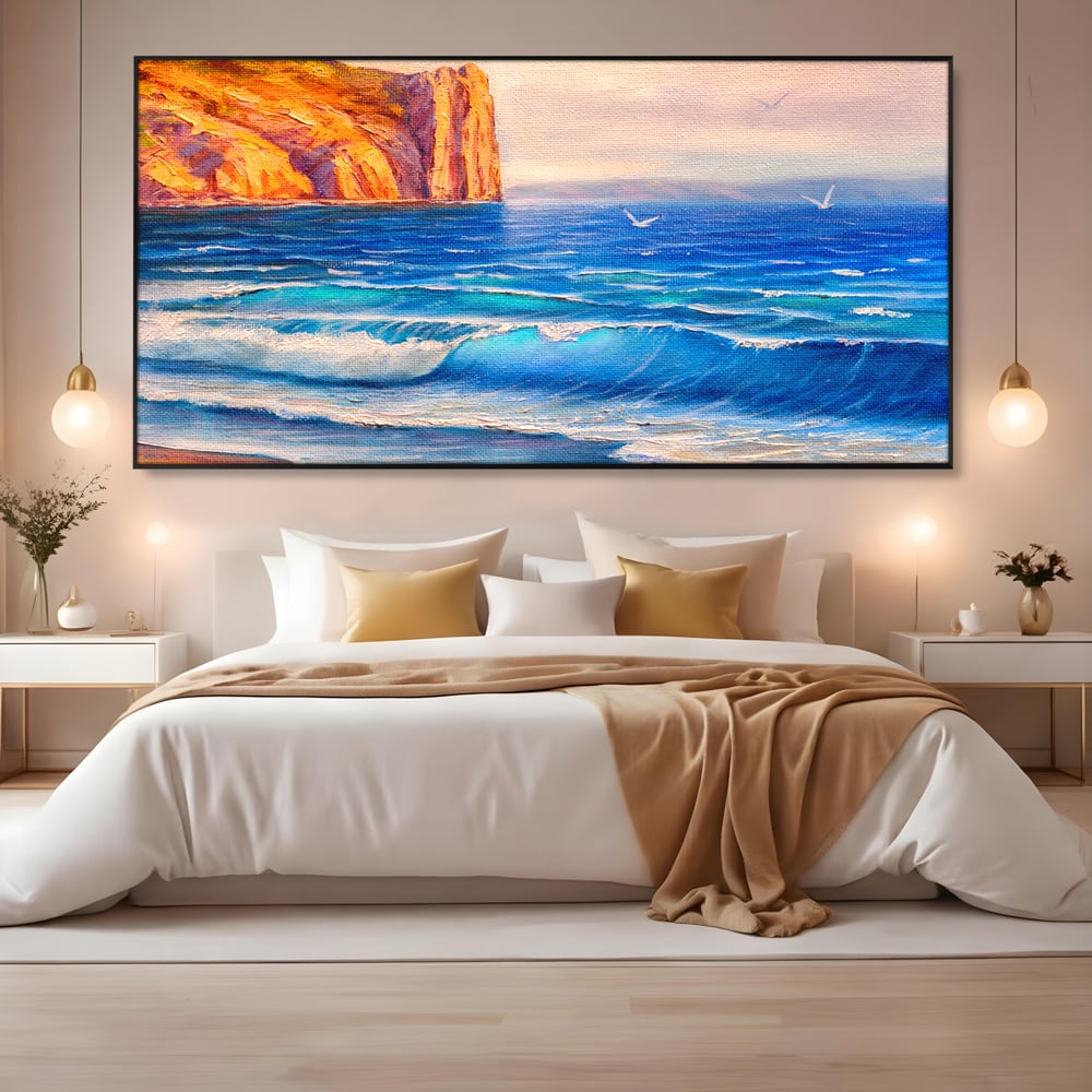 Tablou canvas cu pictura cu stanca pe malul marii, in rama de aluminiu negru, pe perete intr-un dormitor