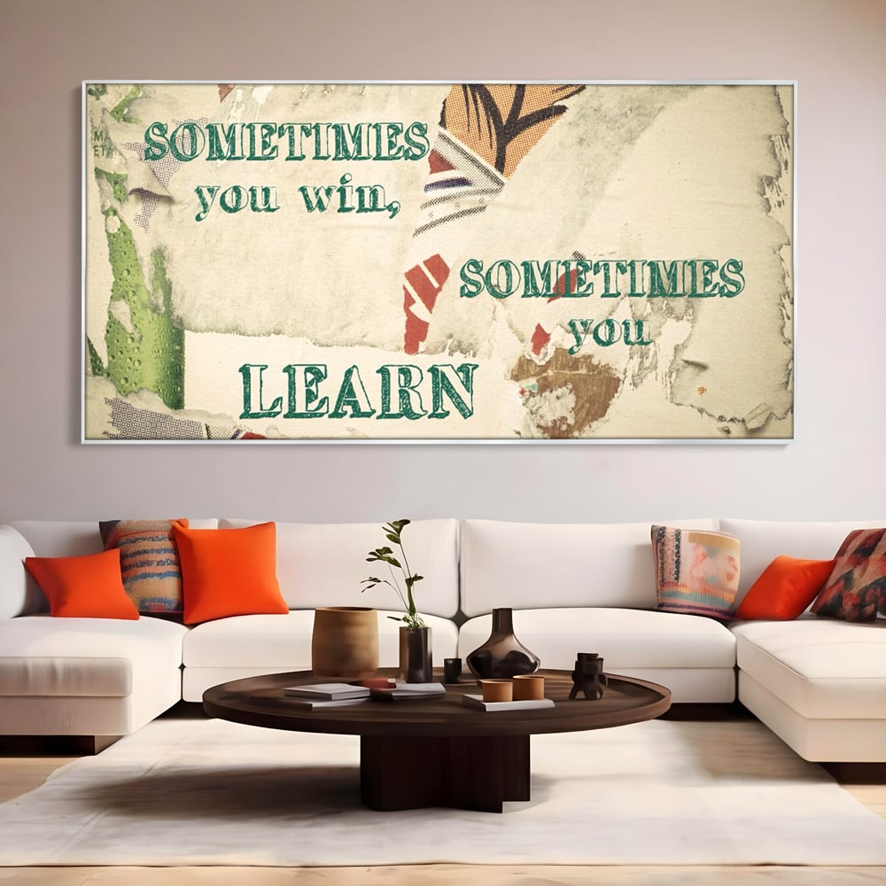 Tablou canvas cu tablou canvas cu mesaj motivational, in rama de aluminiu argintiu, pe perete intr-un living