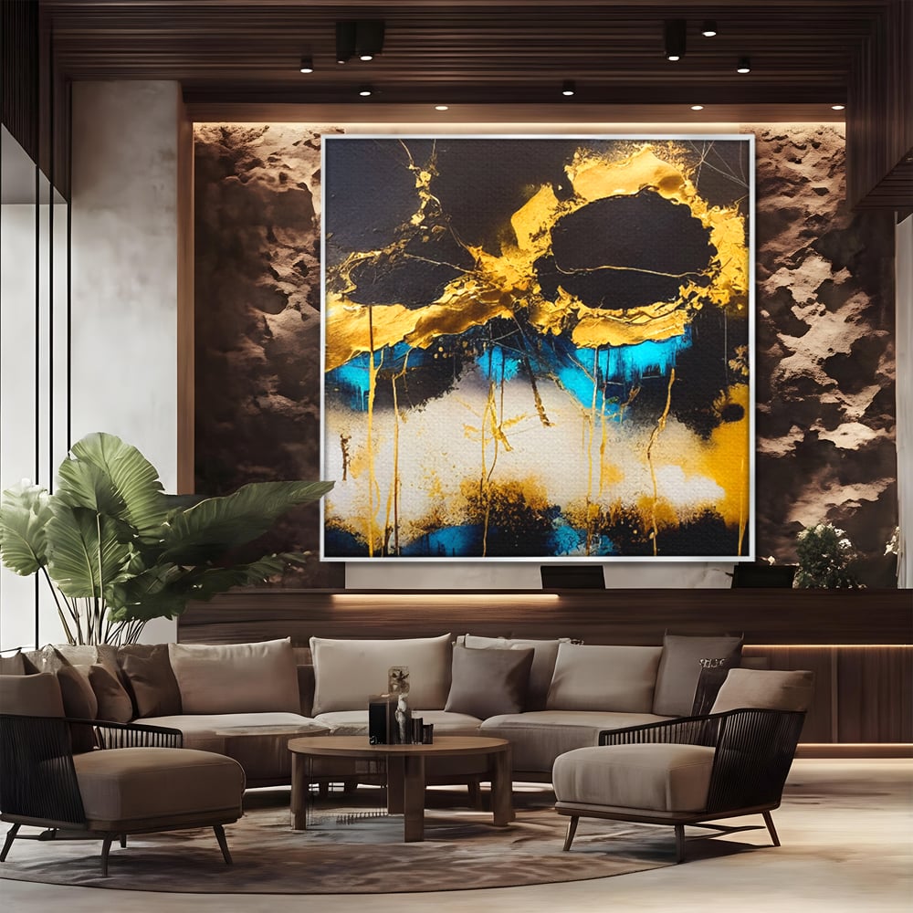 Tablou canvas cu pictura abstracta cu forme aurii si albastre, in rama de aluminiu argintiu, pe perete intr-un birou