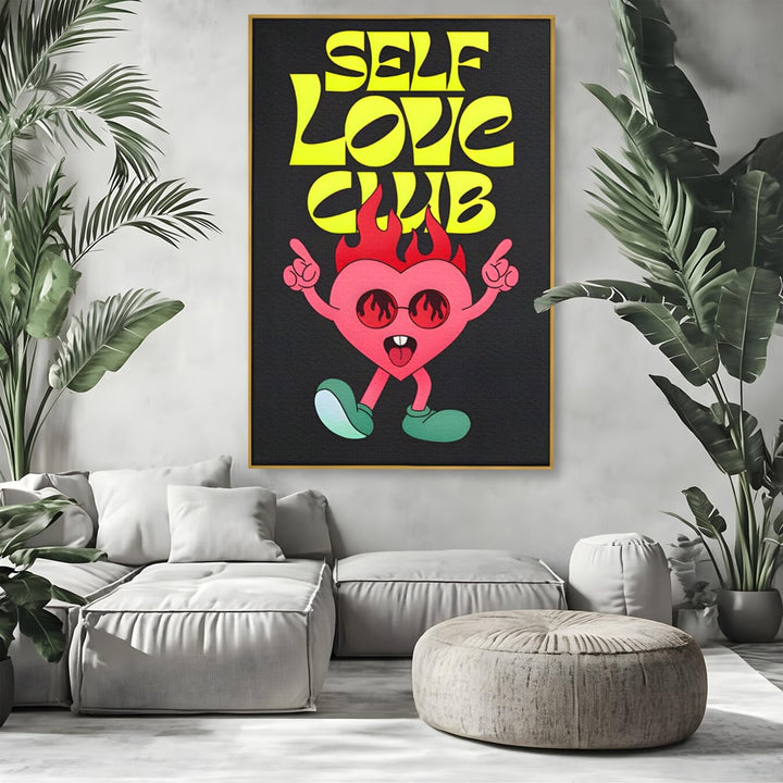 Tablou canvas cu ilustratie cu inimioara dansatoare si flacari, in rama de aluminiu auriu, pe perete intr-un living