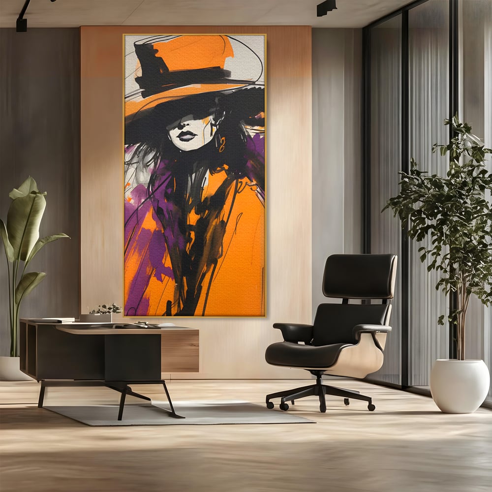Tablou canvas cu ilustratie portret femeie cu palarie portocalie, in rama de aluminiu auriu, pe perete intr-un birou