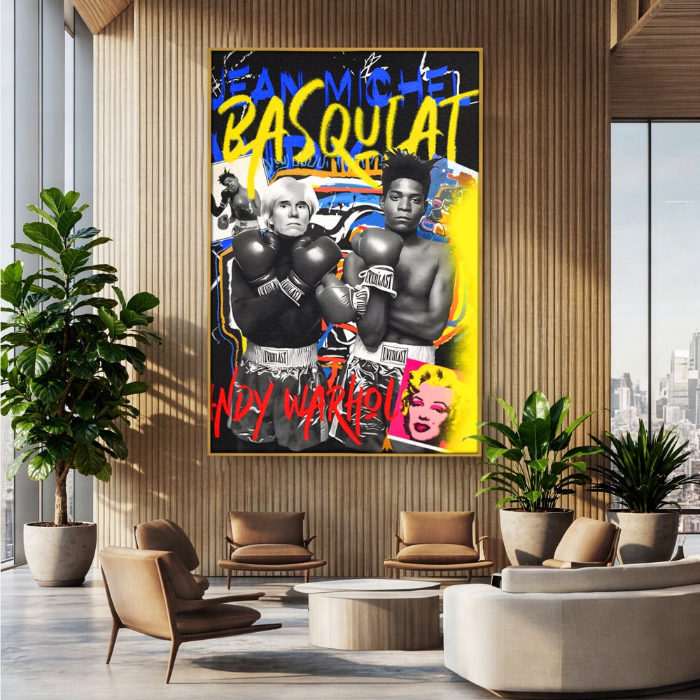 Tablou canvas cu tablou canvas cu andy warhol si basquiat, in rama de aluminiu auriu, pe perete intr-un birou