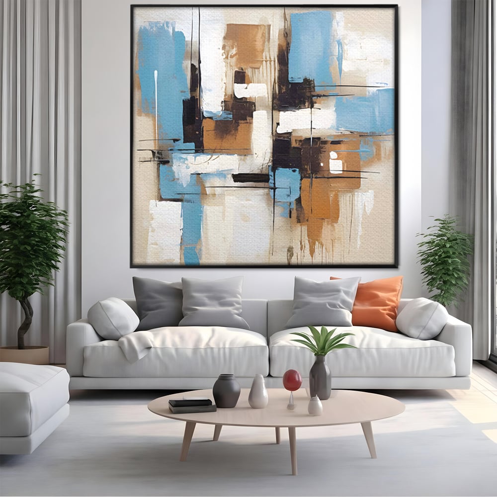 Tablou canvas cu pictura abstracta cu forme geometrice albastre, in rama de aluminiu negru, pe perete intr-un living