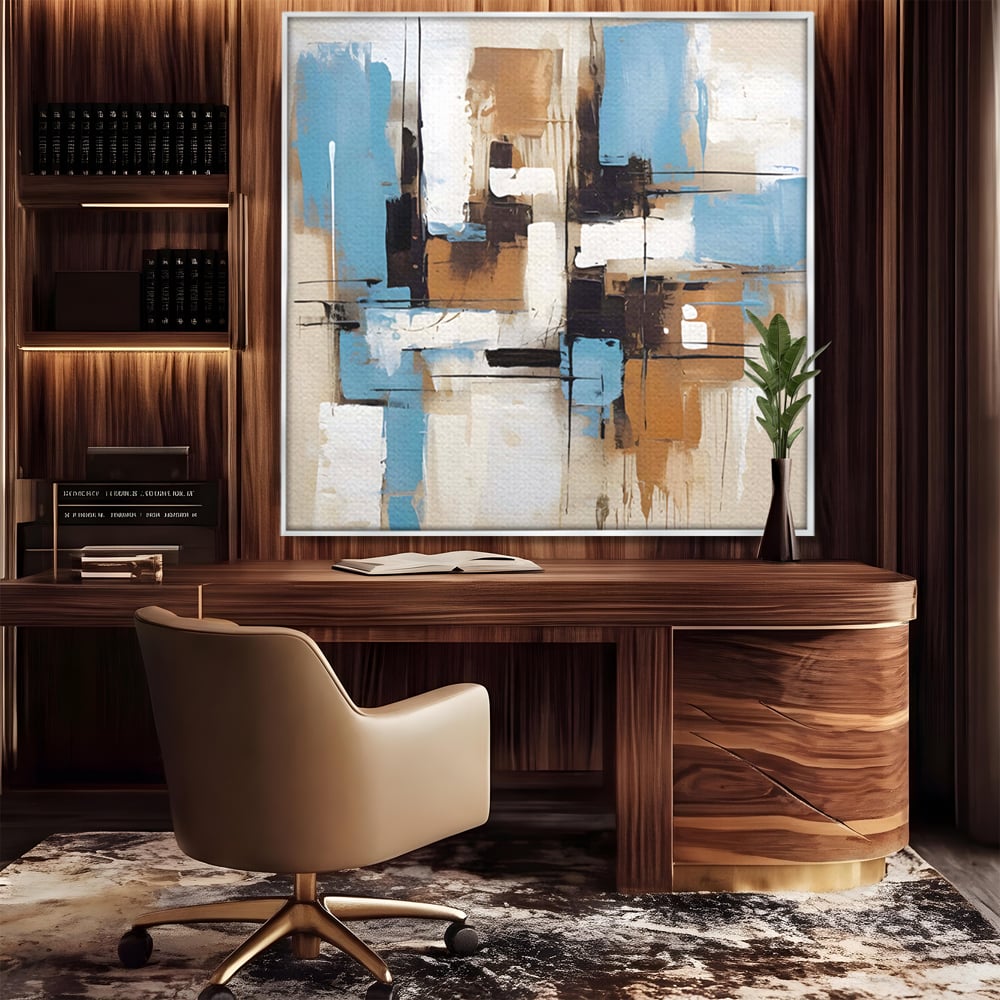 Tablou canvas cu pictura abstracta cu forme geometrice albastre, in rama de aluminiu argintiu, pe perete intr-un birou
