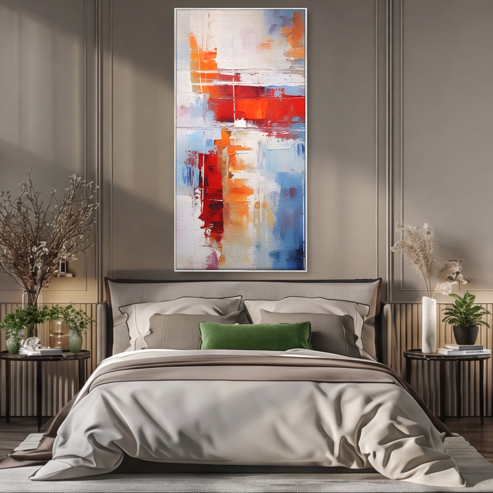 Tablou canvas cu pictura abstracta cu rosu si albastru, in rama de aluminiu argintiu, pe perete intr-un dormitor