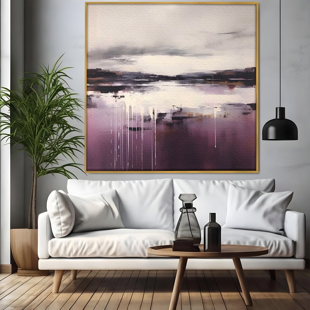 Tablou canvas cu pictura abstracta cu peisaj si picaturi albe, in rama de aluminiu auriu, pe perete intr-un living