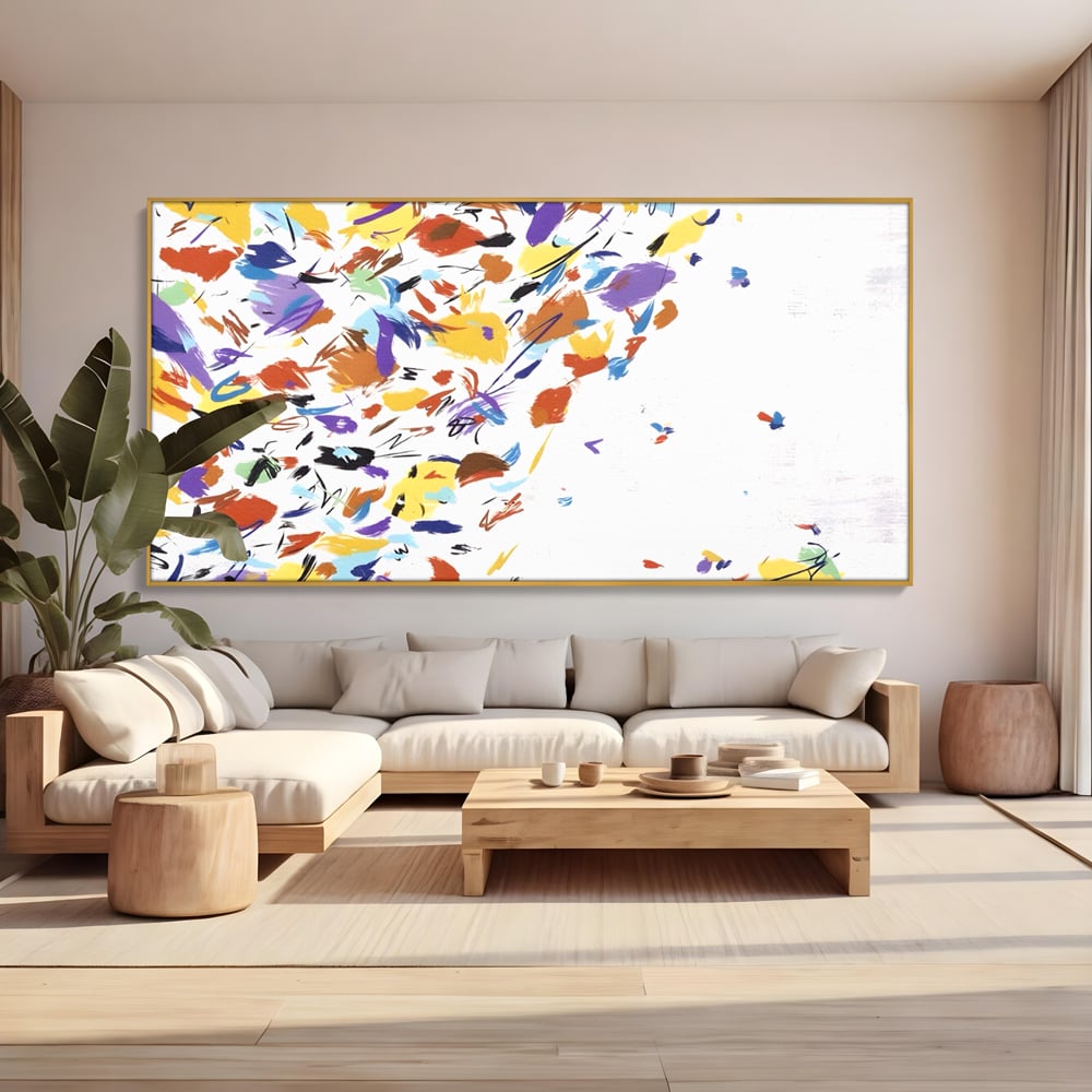 Tablou canvas cu pictura abstracta cu frunze colorate, in rama de aluminiu auriu, pe perete intr-un living