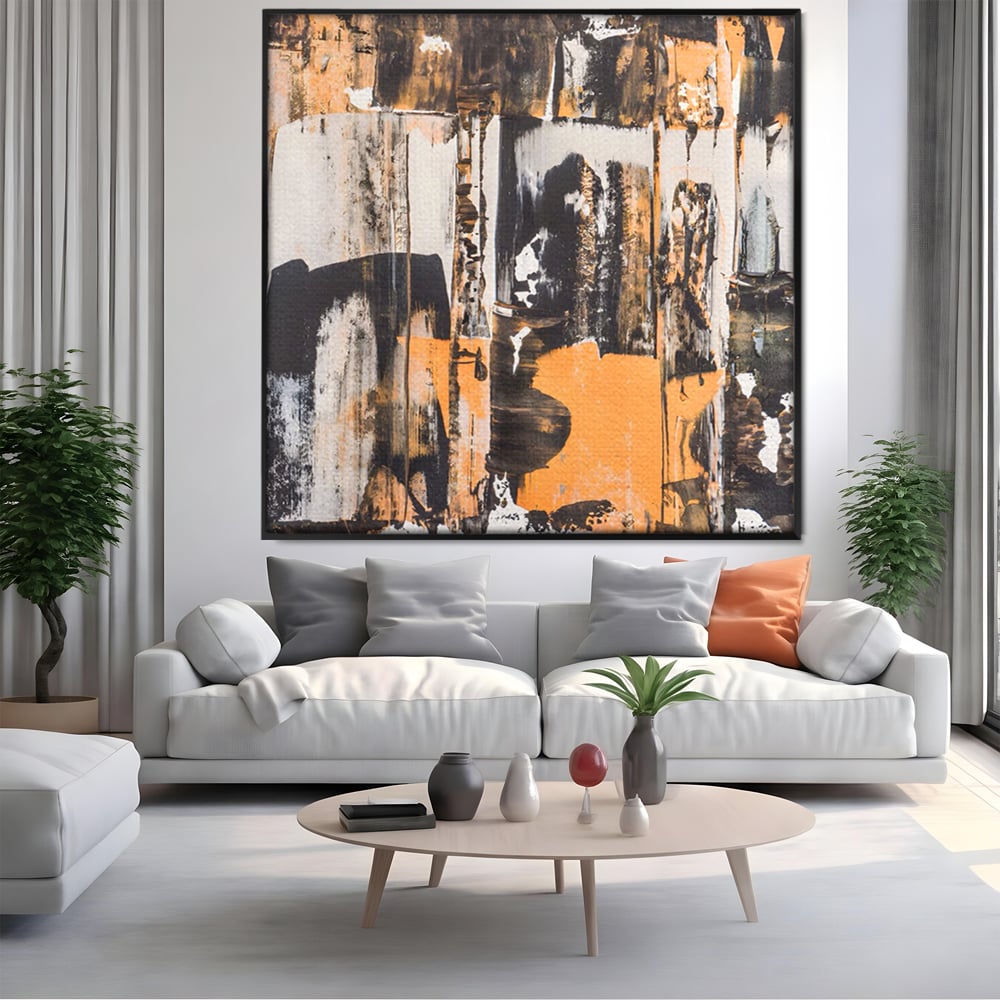 Tablou canvas cu pictura abstracta cu linii si pete, in rama de aluminiu negru, pe perete intr-un living