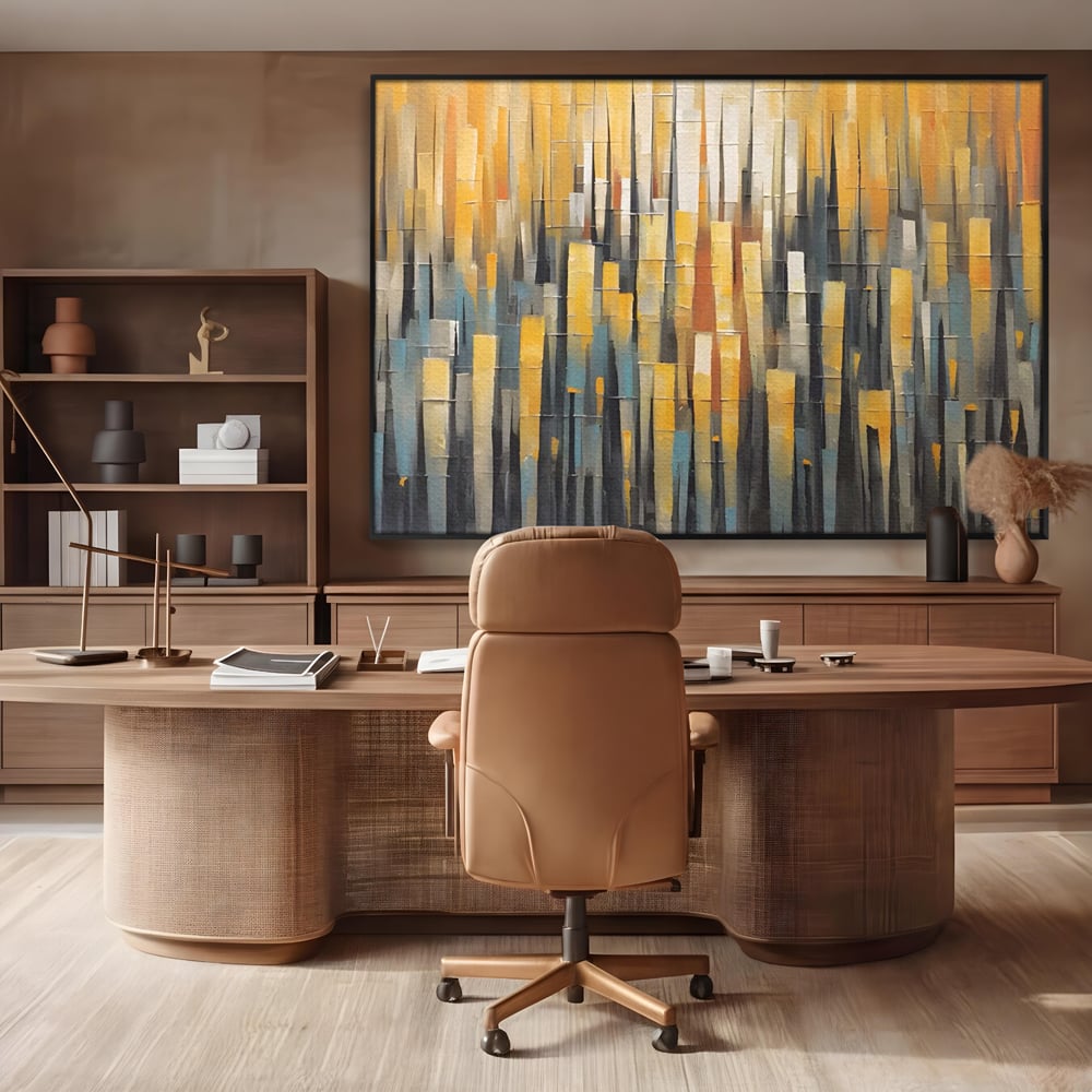Tablou canvas cu pictura abstracta cu dungi verticale aurii, in rama de aluminiu negru, pe perete intr-un birou