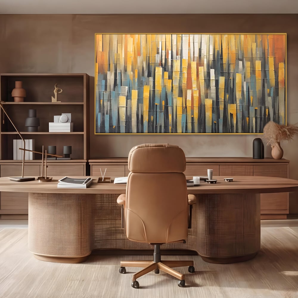 Tablou canvas cu pictura abstracta cu dungi verticale aurii, in rama de aluminiu auriu, pe perete intr-un birou
