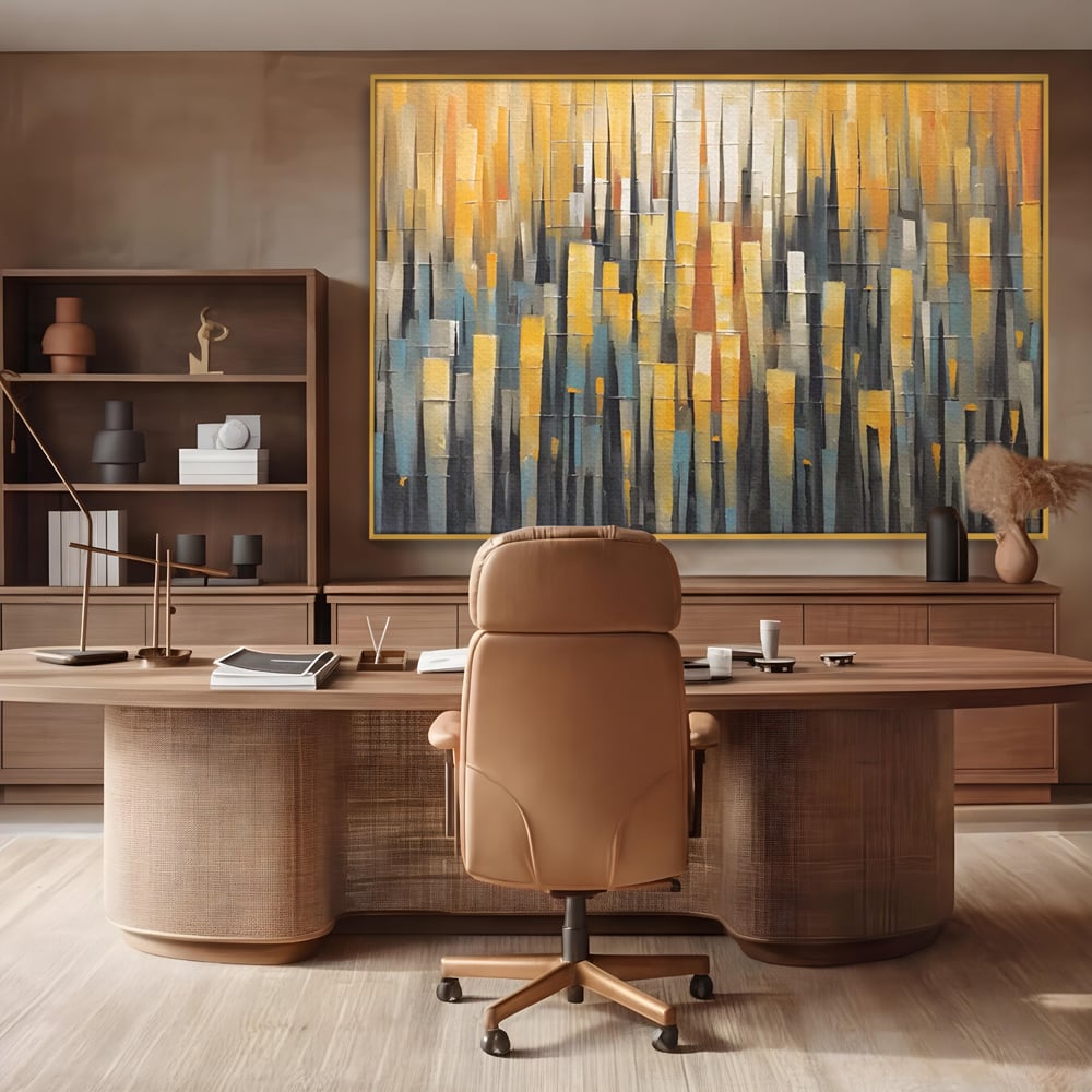 Tablou canvas cu pictura abstracta cu dungi verticale aurii, in rama de aluminiu auriu, pe perete intr-un birou