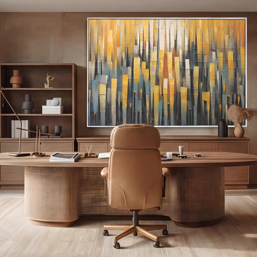 Tablou canvas cu pictura abstracta cu dungi verticale aurii, in rama de aluminiu argintiu, pe perete intr-un birou