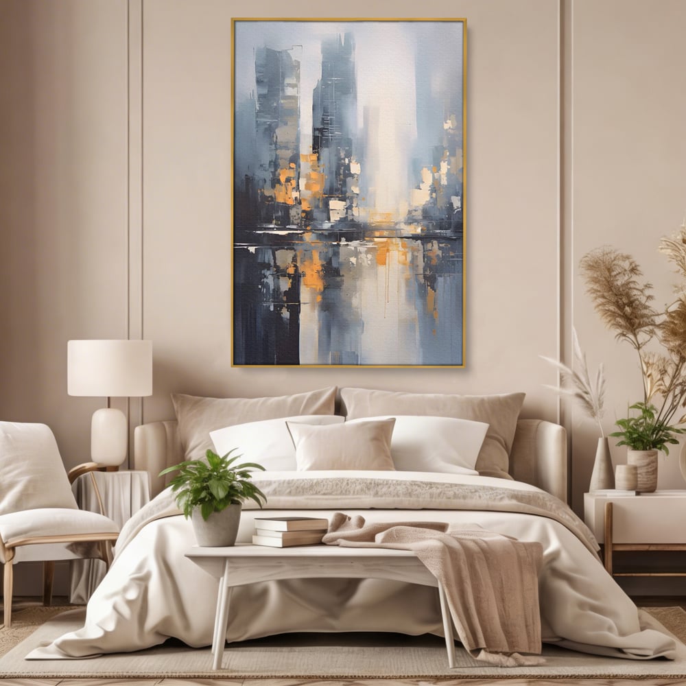 Tablou canvas cu pictura abstracta cu cladiri si reflexii, in rama de aluminiu auriu, pe perete intr-un dormitor