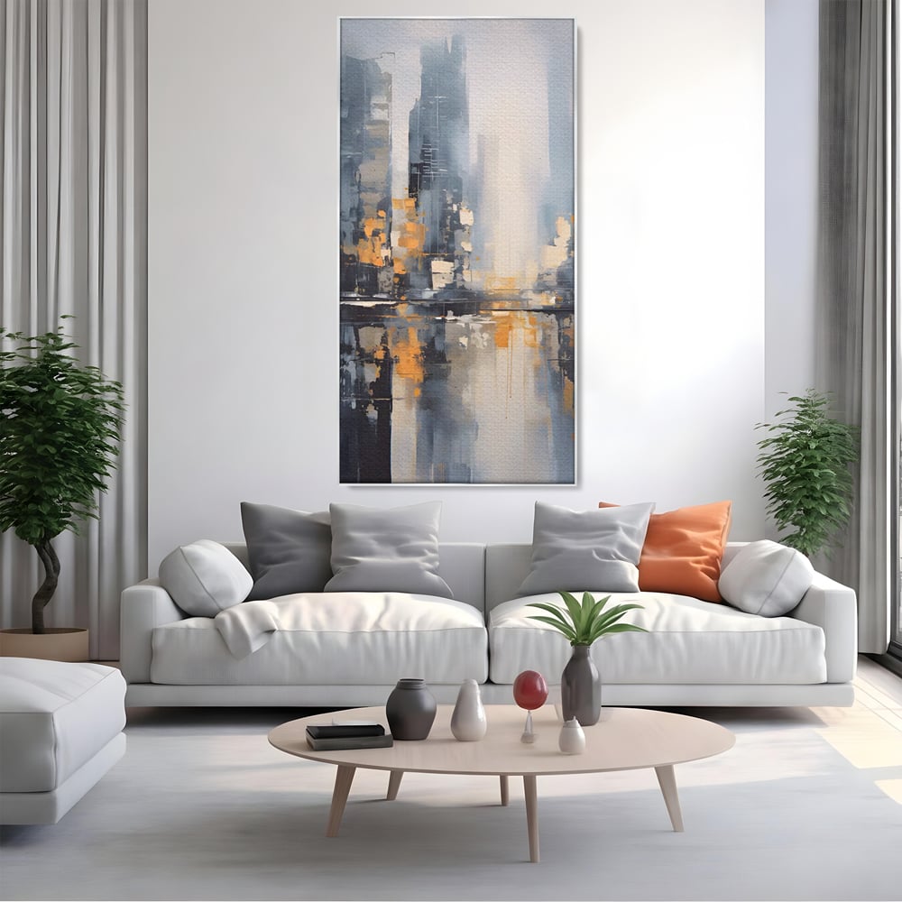 Tablou canvas cu pictura abstracta cu cladiri si reflexii, in rama de aluminiu argintiu, pe perete intr-un living