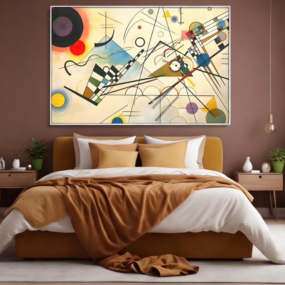 Tablou canvas cu pictura abstracta cu forme geometrice colorate, in rama de aluminiu argintiu, pe perete intr-un dormitor