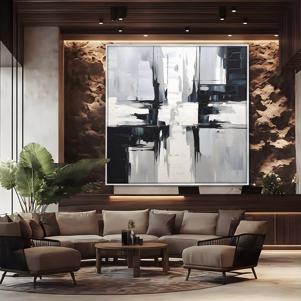 Tablou canvas cu pictura abstracta alb-negru, in rama de aluminiu argintiu, pe perete intr-un birou