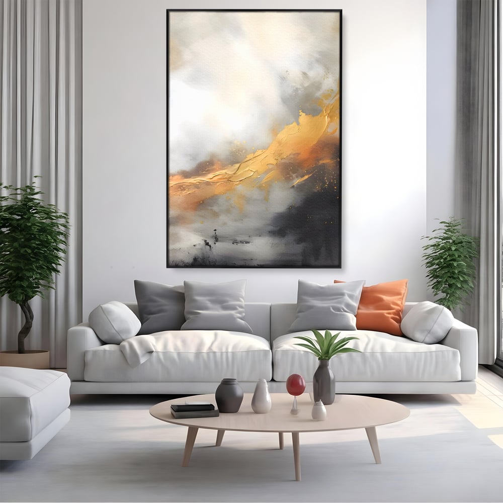 Tablou canvas cu pictura abstracta cu tusa aurie si tonuri gri, in rama de aluminiu negru, pe perete intr-un living