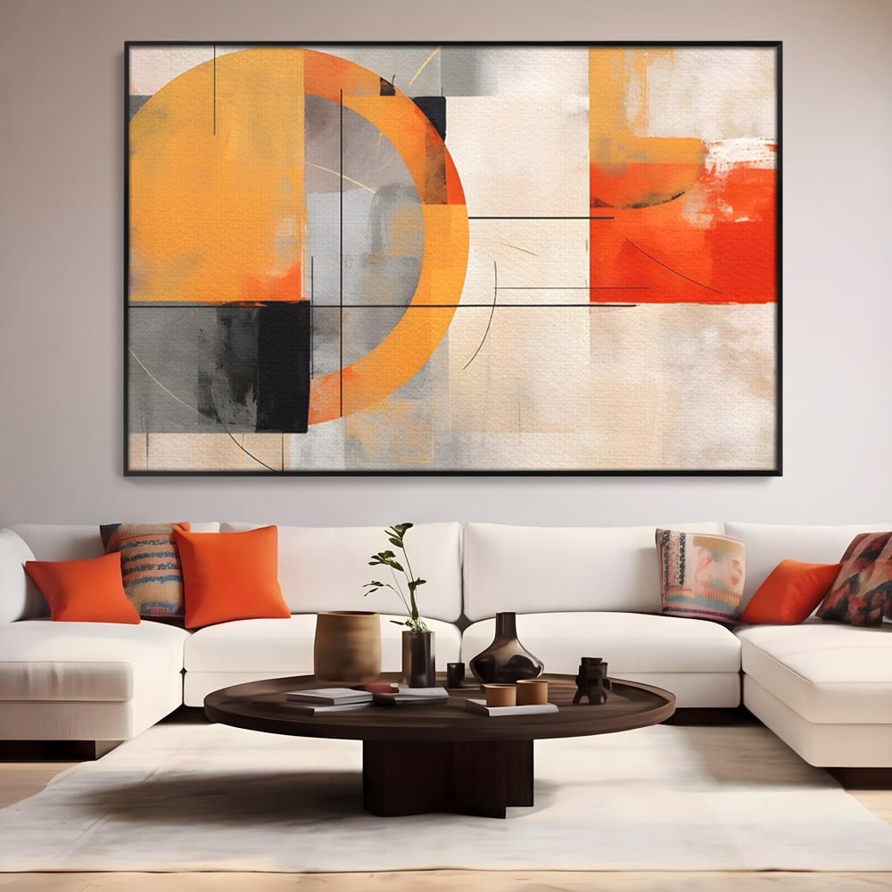 Tablou canvas cu pictura abstracta cu cerc galben, in rama de aluminiu negru, pe perete intr-un living