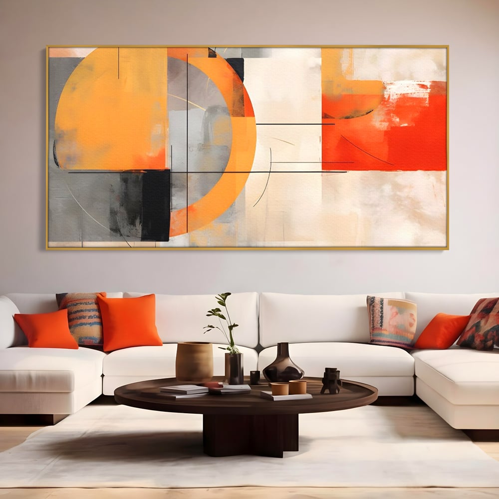 Tablou canvas cu pictura abstracta cu cerc galben, in rama de aluminiu auriu, pe perete intr-un living