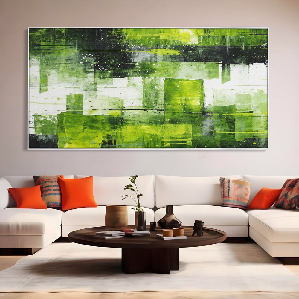 Tablou canvas cu pictura abstracta cu straturi verzi, in rama de aluminiu argintiu, pe perete intr-un living
