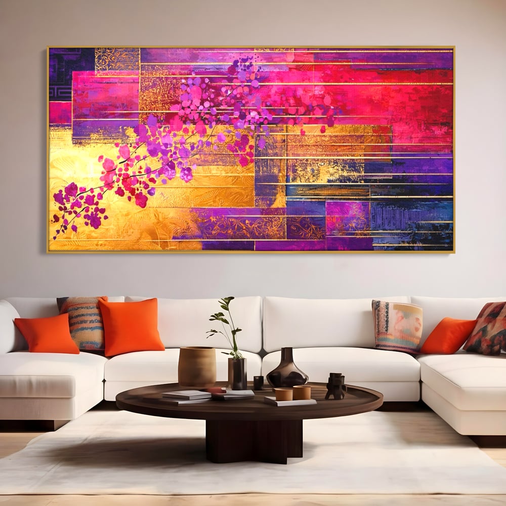 Tablou canvas cu pictura abstracta cu flori roz si linii aurii, in rama de aluminiu auriu, pe perete intr-un living