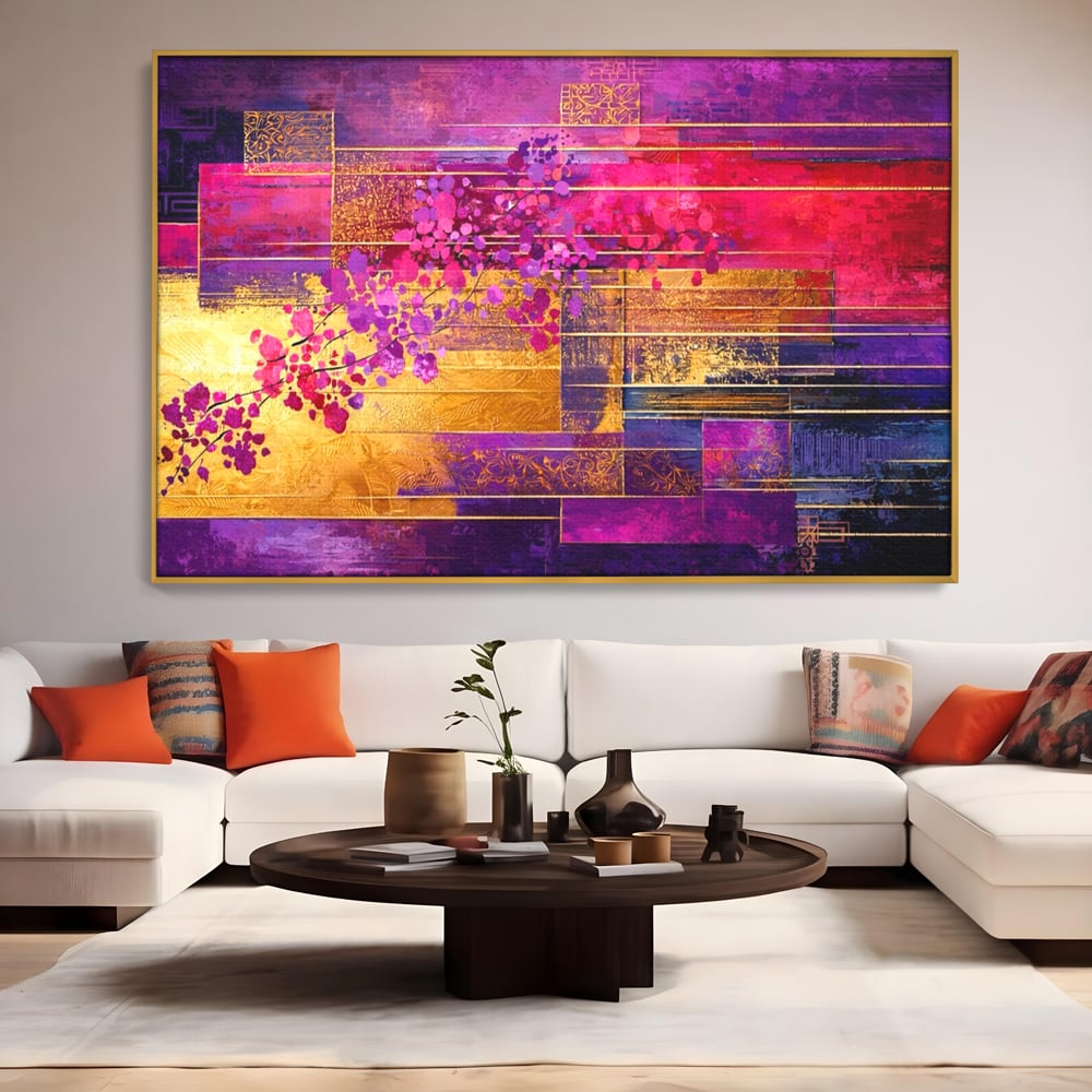 Tablou canvas cu pictura abstracta cu flori roz si linii aurii, in rama de aluminiu auriu, pe perete intr-un living