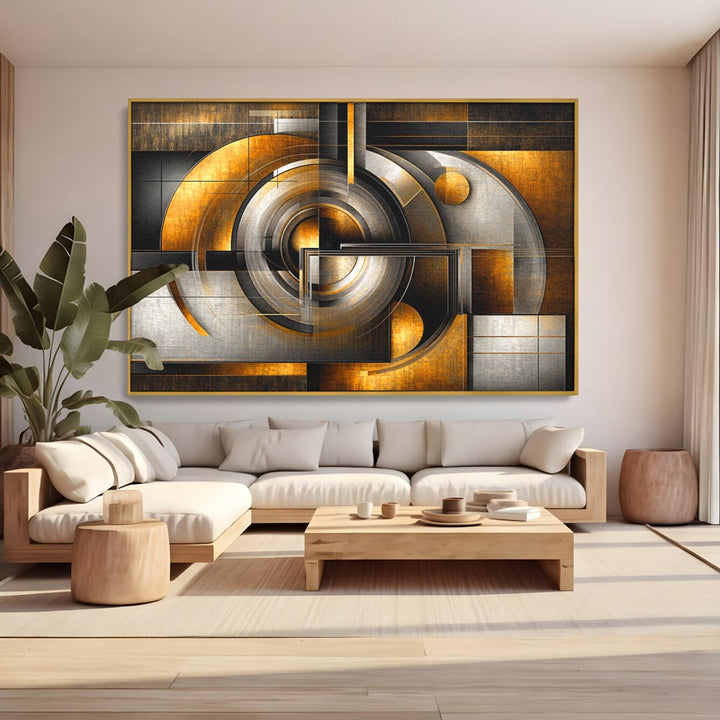 Tablou canvas cu tablou canvas cu cercuri geometrice aurii, in rama de aluminiu auriu, pe perete intr-un living