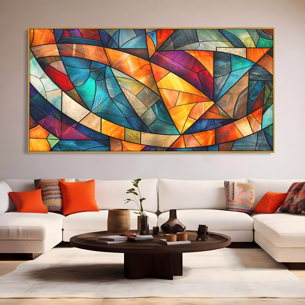 Tablou canvas cu tablou canvas cu mozaic geometric colorat, in rama de aluminiu auriu, pe perete intr-un living