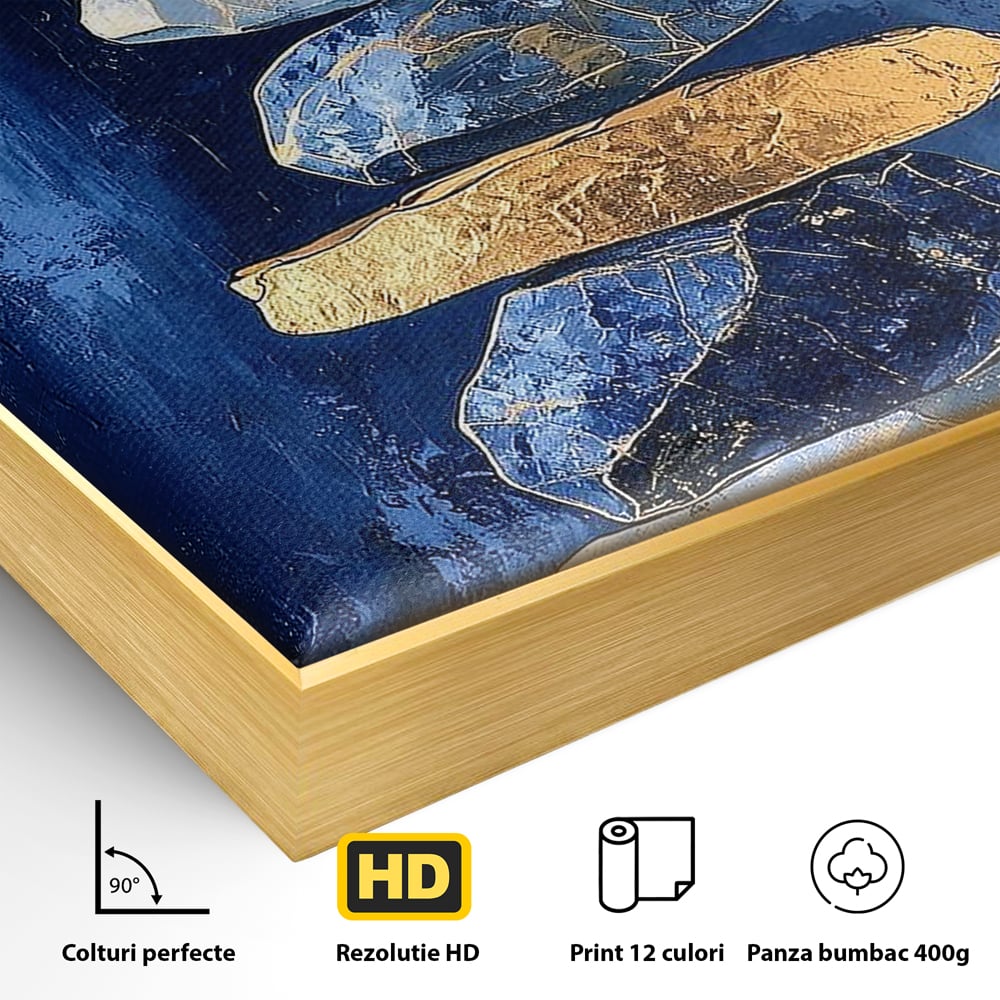 Detaliu al suprafetei: tablou canvas cu stive de pietre si cerc auriu, in rama de aluminiu auriu