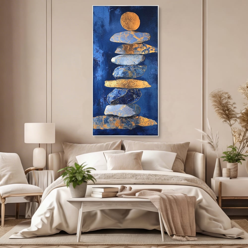 Tablou canvas cu tablou canvas cu stive de pietre si cerc auriu, in rama de aluminiu argintiu, pe perete intr-un dormitor