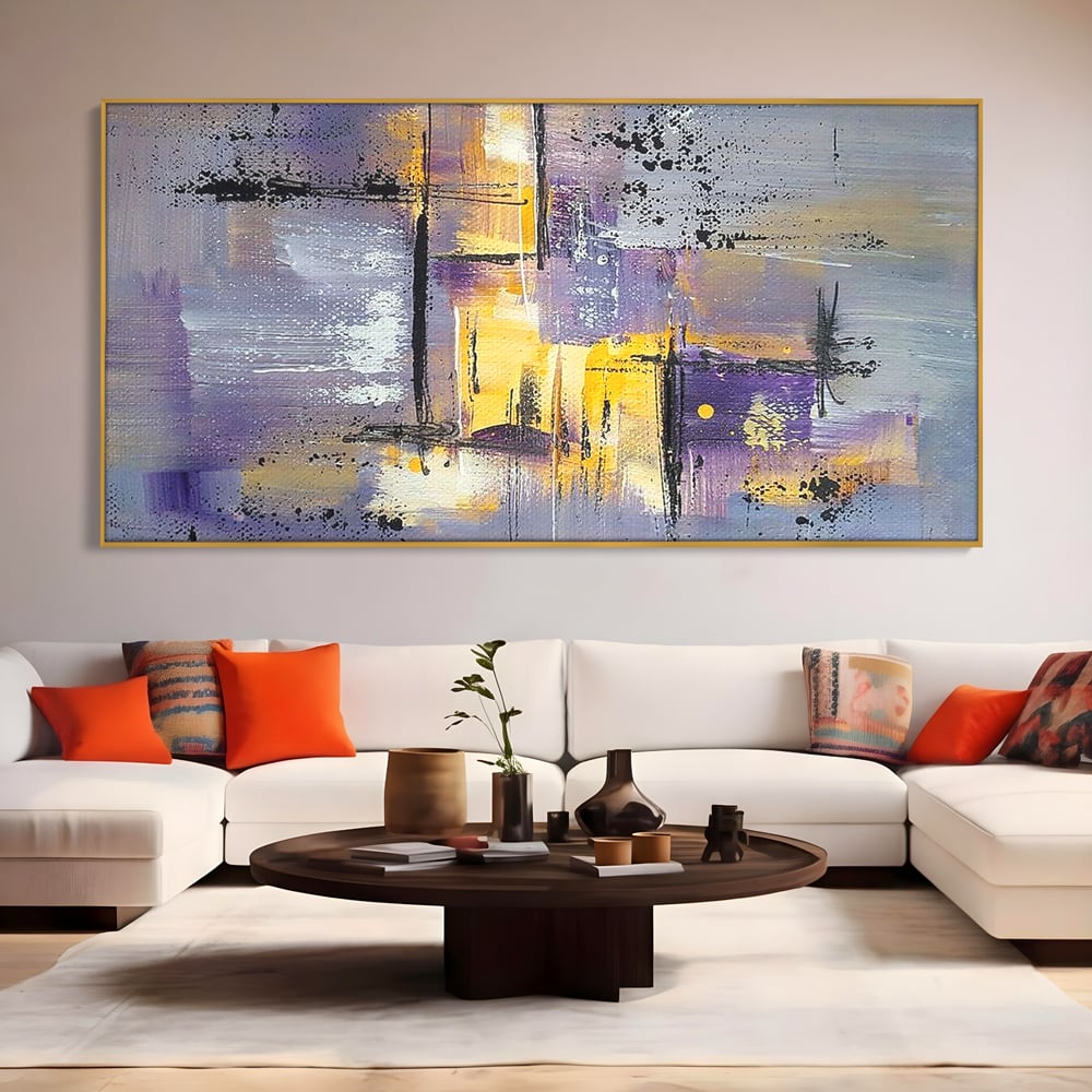 Tablou canvas cu pictura abstracta cu linii si pete, in rama de aluminiu auriu, pe perete intr-un living