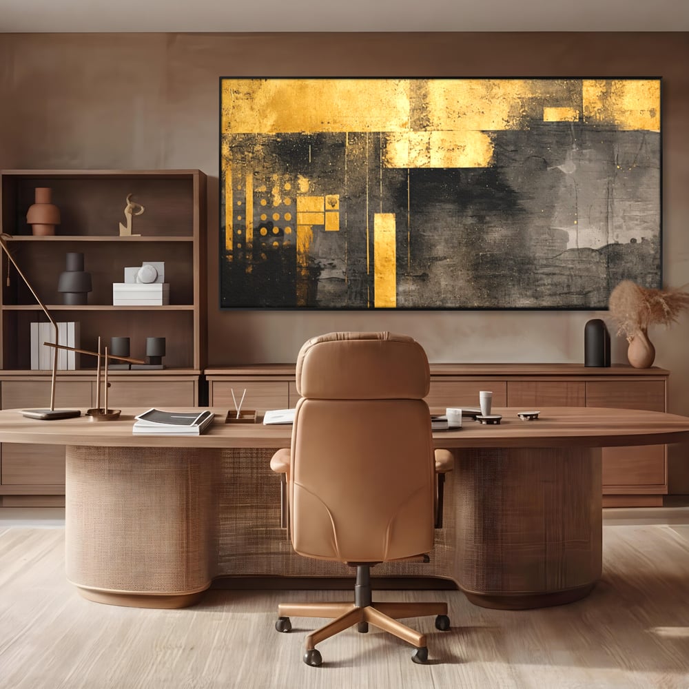 Tablou canvas cu pictura abstracta cu forme geometrice aurii, in rama de aluminiu negru, pe perete intr-un birou