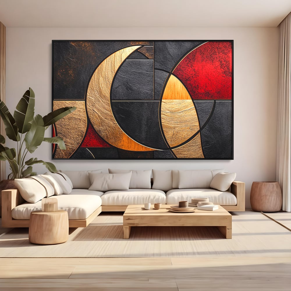 Tablou canvas cu tablou canvas cu forme geometrice aurii si rosii, in rama de aluminiu negru, pe perete intr-un living