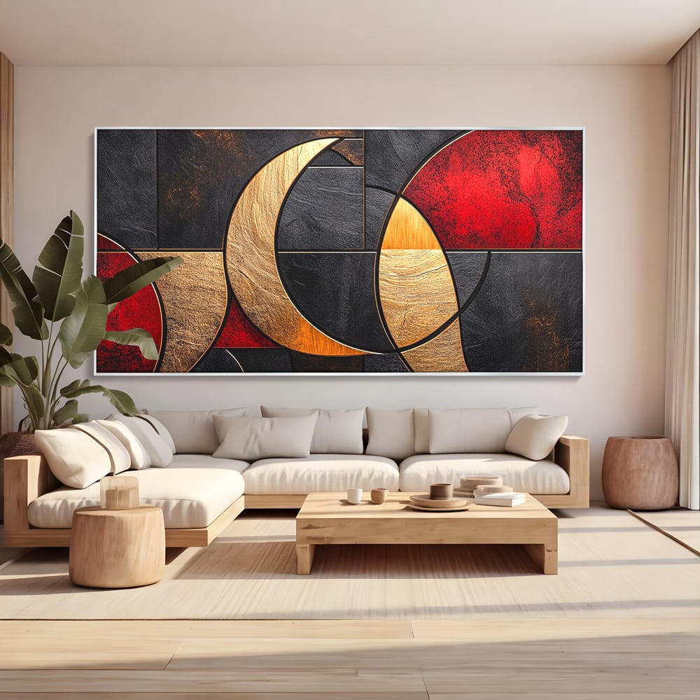 Tablou canvas cu tablou canvas cu forme geometrice aurii si rosii, in rama de aluminiu argintiu, pe perete intr-un living