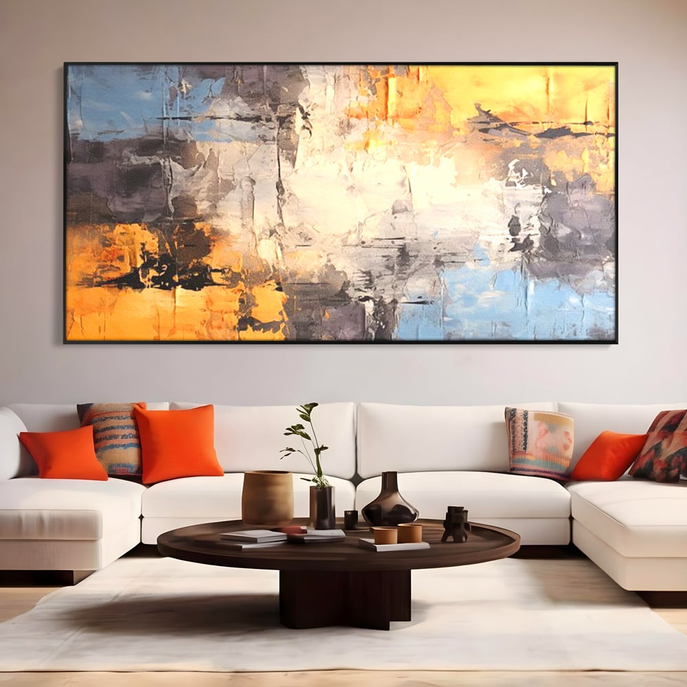 Tablou canvas cu pictura abstracta cu texturi portocalii si gri, in rama de aluminiu negru, pe perete intr-un living