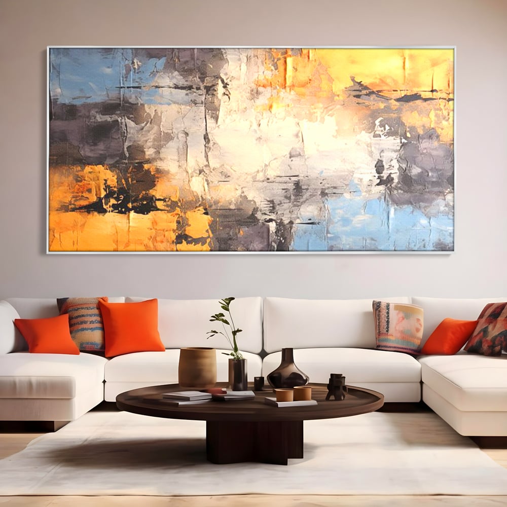 Tablou canvas cu pictura abstracta cu texturi portocalii si gri, in rama de aluminiu argintiu, pe perete intr-un living