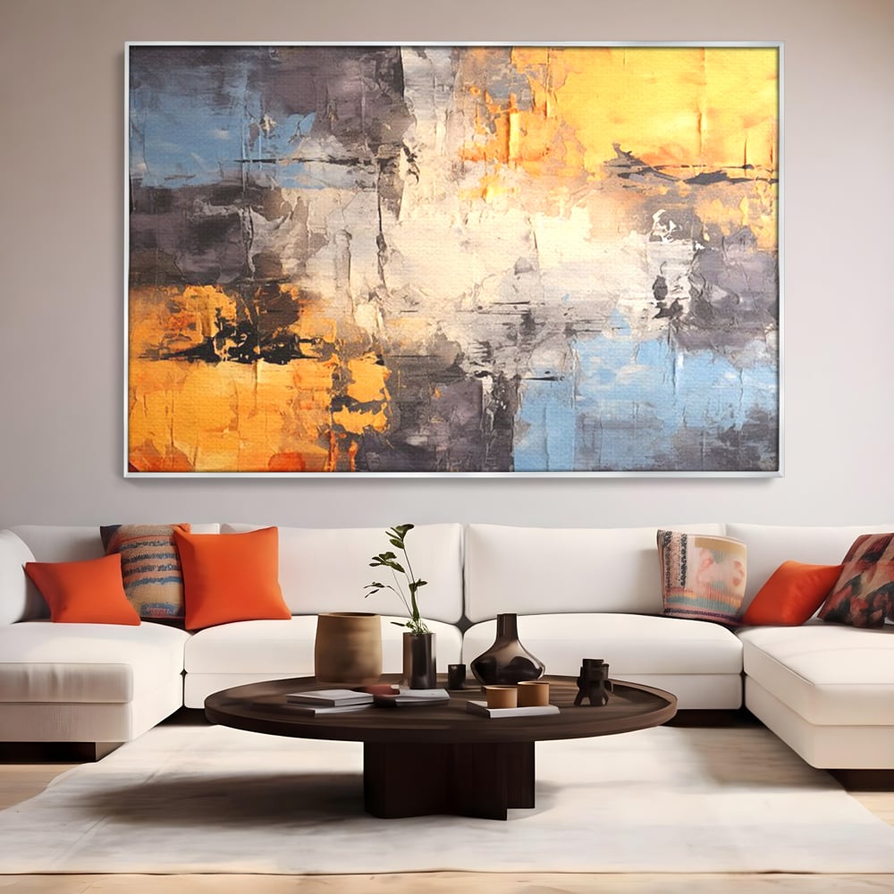 Tablou canvas cu pictura abstracta cu texturi portocalii si gri, in rama de aluminiu argintiu, pe perete intr-un living