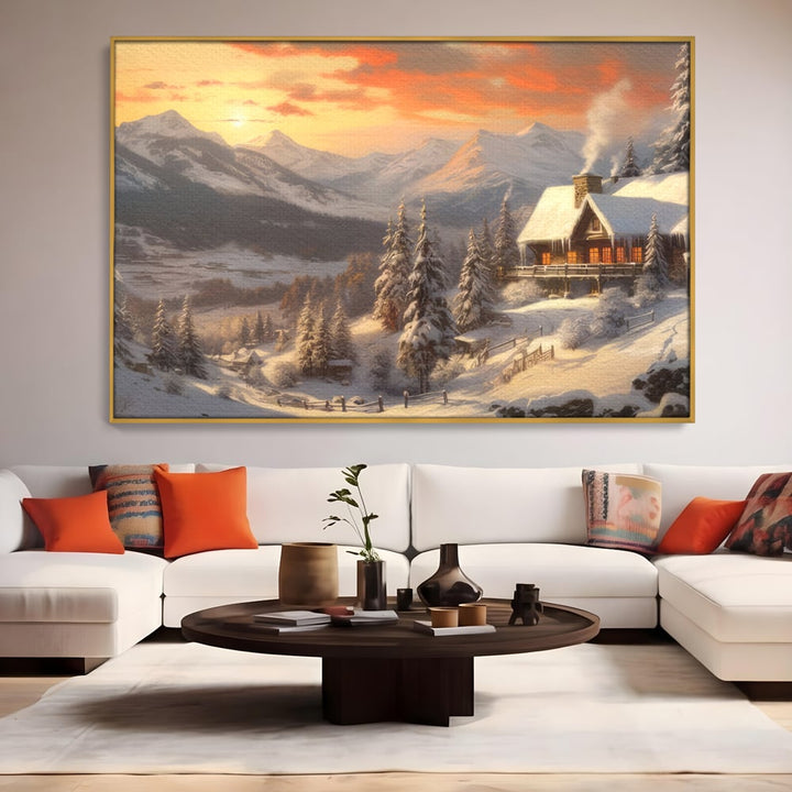 Tablou canvas cu pictura cu cabana in munti iarna, in rama de aluminiu auriu, pe perete intr-un living