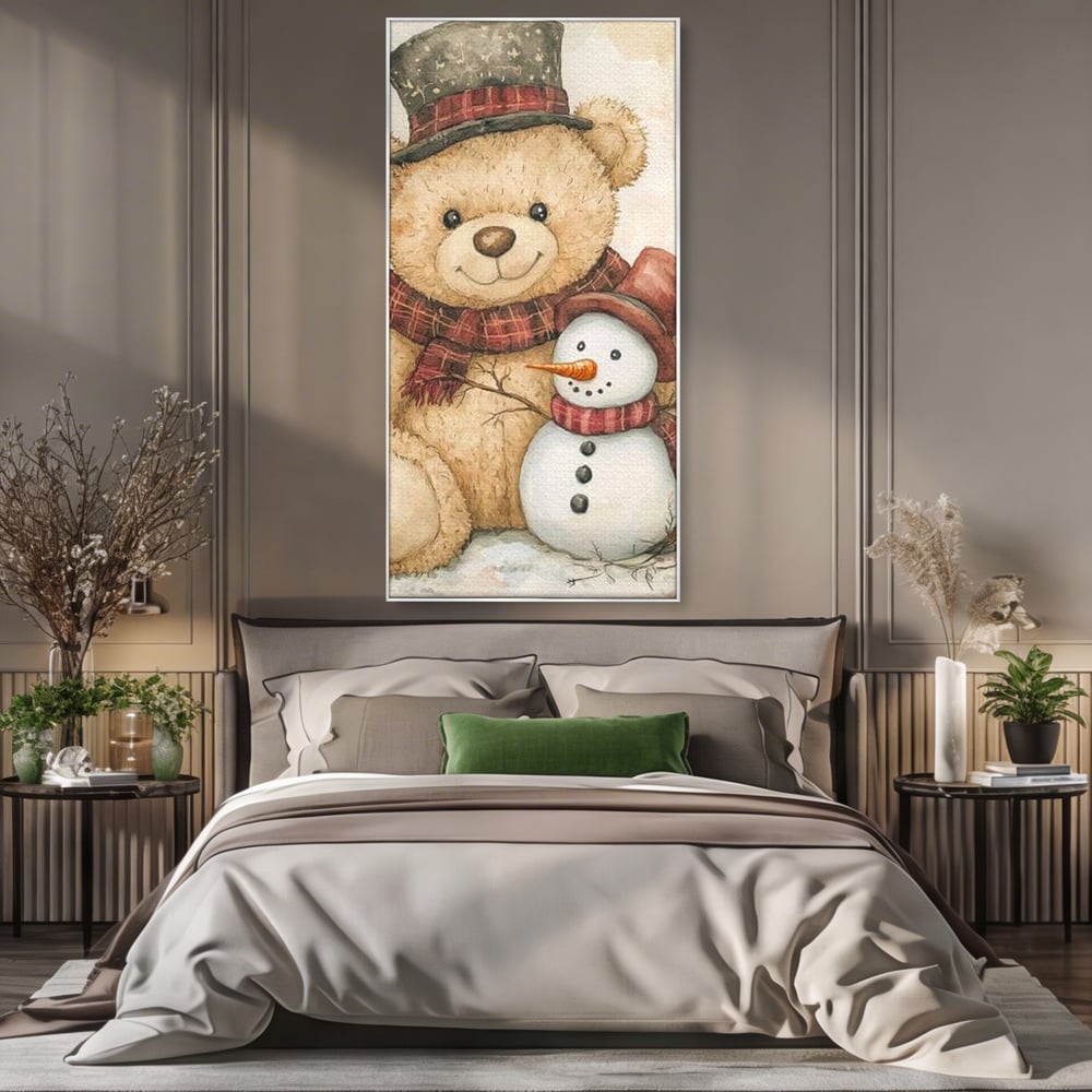 Tablou canvas cu ilustratie cu ursulet si om de zapada, in rama de aluminiu argintiu, pe perete intr-un dormitor