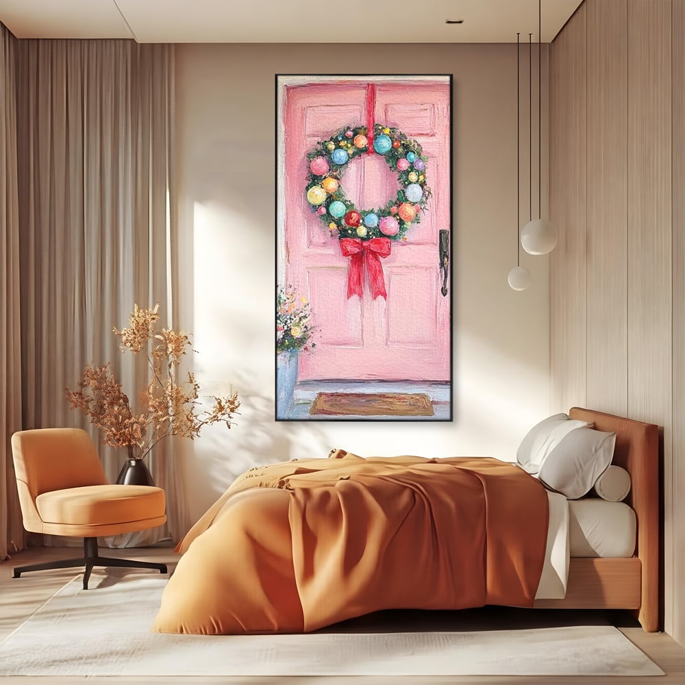 Tablou canvas cu pictura cu usa roz si coronita de craciun, in rama de aluminiu negru, pe perete intr-un dormitor