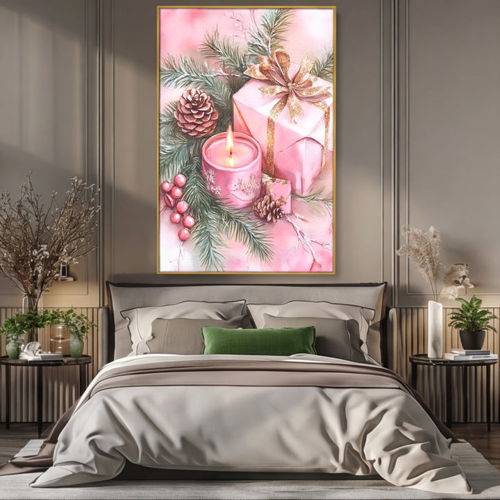 Tablou canvas cu ilustratie cu lumanare si cadou roz, in rama de aluminiu auriu, pe perete intr-un dormitor