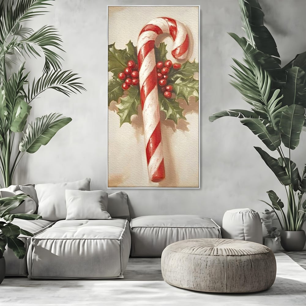 Tablou canvas cu pictura cu baston de zahar si frunze, in rama de aluminiu argintiu, pe perete intr-un living