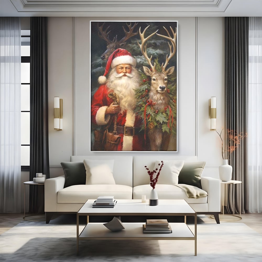 Tablou canvas cu tablou canvas cu mos craciun si cerbi, in rama de aluminiu argintiu, pe perete intr-un living